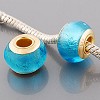 Vergulde glasbedel in turquoise zilverfolie